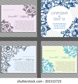 Wedding invitation cards with floral elements.