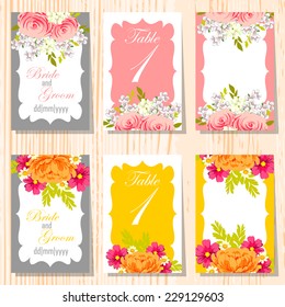 Wedding invitation cards with floral elements.