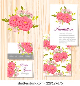 Wedding invitation cards with floral elements.