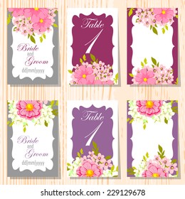 Wedding invitation cards with floral elements.