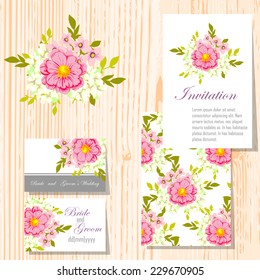 Wedding invitation cards with floral elements.