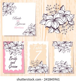Wedding invitation cards with floral elements.