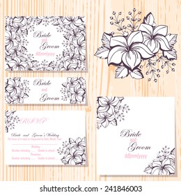 Wedding invitation cards with floral elements.