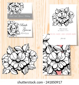 Wedding invitation cards with floral elements.