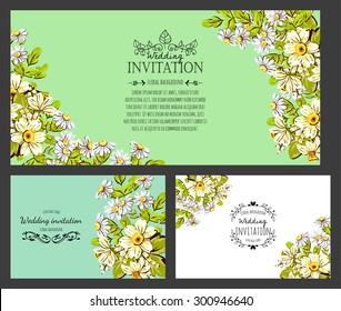 Wedding invitation cards with floral elements.
