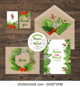 wedding invitation cards with tropical plants and flowers