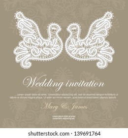 Wedding invitation decorated with lace pigeons.