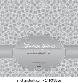 Wedding invitation decorated with a pattern of lace and pearls