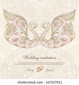 Wedding invitation decorated with swans and rings