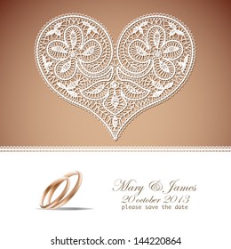 Wedding invitation decorated with white lace  hearts and gold wedding rings