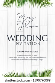 Wedding Invitation with palms on the white wooden background