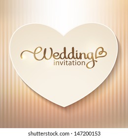 wedding invitation with paper heart and gold background