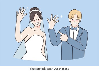 Wedding and marriage day concept. Smiling young happy couple wife and husband standing showing rings on fingers feeling excited vector illustration 