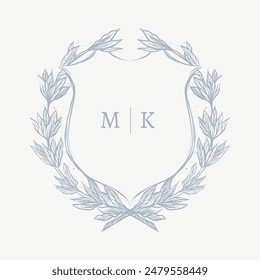 Wedding monogram crest design with MK initial surrounded by floral elements