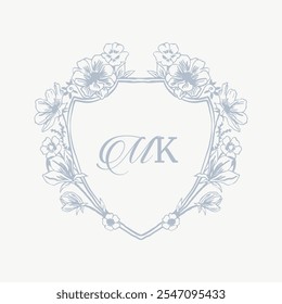 Wedding monogram crest design with MK initial surrounded by baroque style intricate motifs