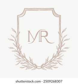 Casamento monograma crista design com MR inicial cercado por motivos intrincados estilo barroco