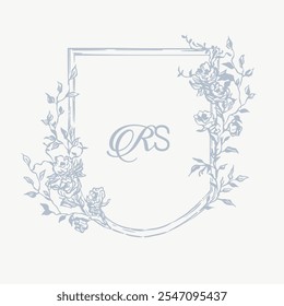 Wedding monogram crest design with RS initial surrounded by baroque style intricate motifs