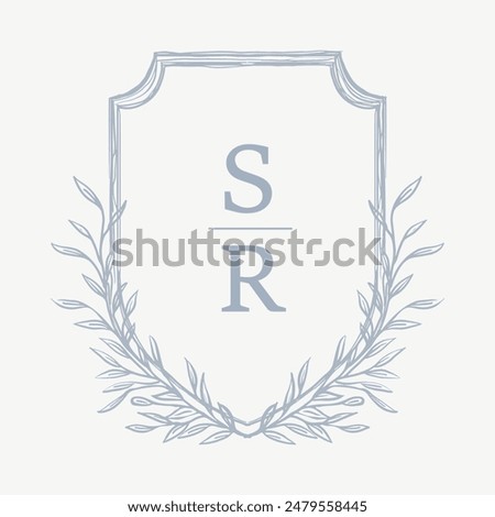 Wedding monogram crest design with SR initial surrounded by floral elements