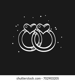 Wedding ring icon in doodle sketch lines.