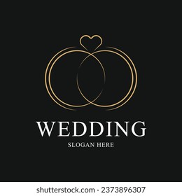 diseño del logotipo de los anillos de boda con icono de anillo y corazón de amor