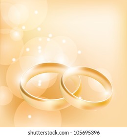 wedding rings on an abstract background