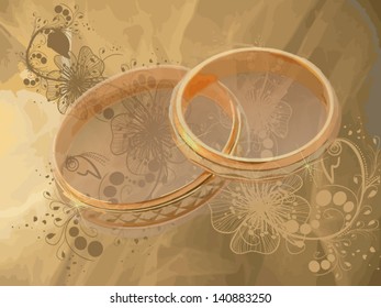 Wedding rings on the background of chiffon