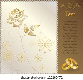 Wedding rings on the floral background with golden rose