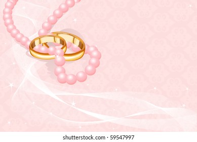 Anillos de boda en el fondo rosado