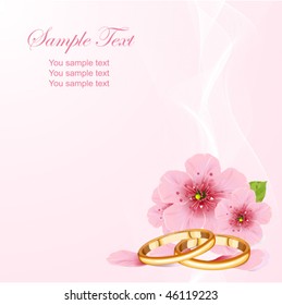 Wedding rings and pink cherry blossom design