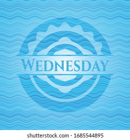 Wednesday light blue water wave style badge. Vector Illustration. Detailed.