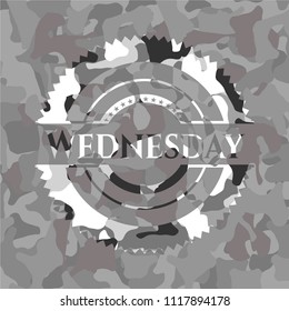 Wednesday on grey camouflage texture