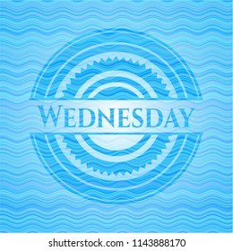 Wednesday sky blue water style badge.