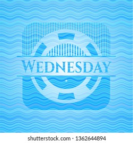 Wednesday sky blue water wave badge.
