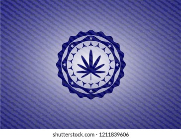 weed leaf icon inside badge with denim texture