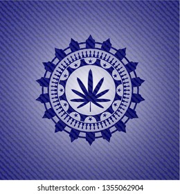weed leaf icon inside badge with denim texture