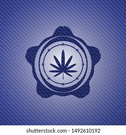 weed leaf icon inside badge with denim texture