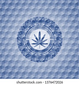 weed leaf icon inside blue emblem with geometric pattern background.