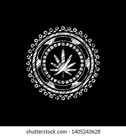 weed leaf icon inside chalkboard emblem written on a blackboard