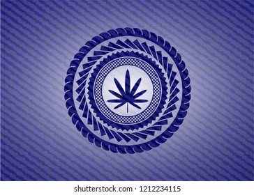 weed leaf icon inside emblem with jean background