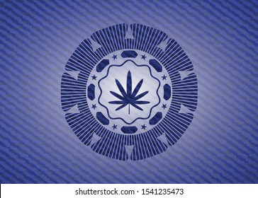weed leaf icon inside emblem with jean background