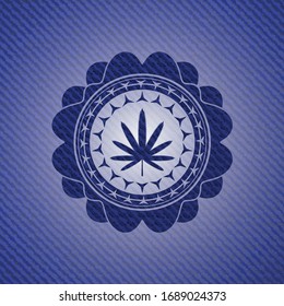 weed leaf icon inside emblem with jean background