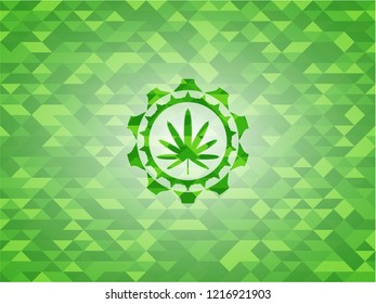 weed leaf icon inside green emblem with triangle mosaic background