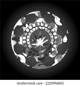 weed leaf icon inside grey camouflaged emblem
