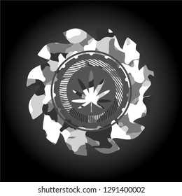 weed leaf icon inside grey camouflaged emblem