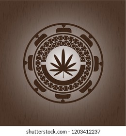 weed leaf icon inside retro style wooden emblem