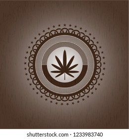 weed leaf icon inside vintage wood emblem