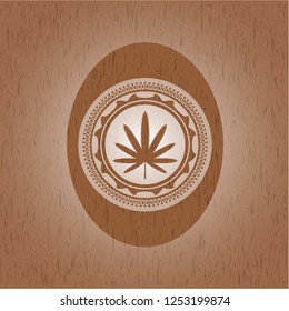 weed leaf icon inside wood badge or emblem