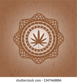 weed leaf icon inside wood badge or emblem