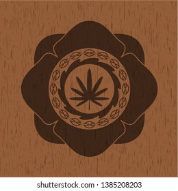 weed leaf icon inside wood emblem