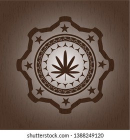 weed leaf icon inside wood badge or emblem